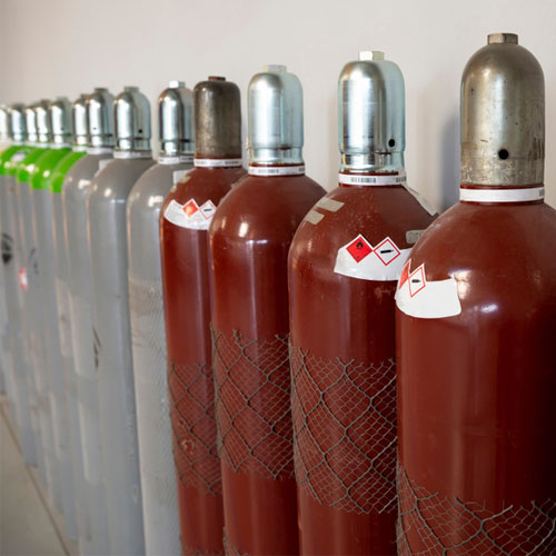 Row of empty gas cylinders